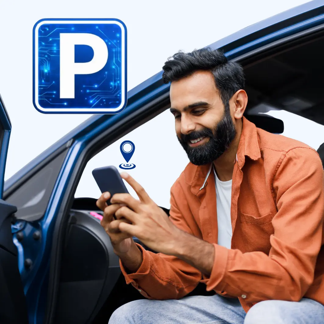 Man sitting in a car using a blueparking app on his phone.
